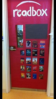 a red door with the words readbox written on it and pictures pinned to it