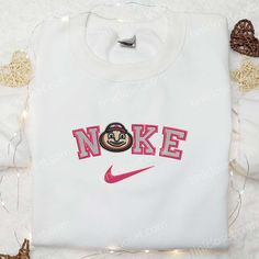 Ohio State Buckeyes x Nike Embroidered Shirt, NCAA Sports Embroidered Hoodie, Best Gift Idea Nestled within the vibrant tapestry of urban life, Tinicloset stands as an embodiment of sartorial elegance and sporting spirit, a sanctuary where threads intertwine to weave tales of tradition, pride, and unyielding excellence. From the moment one crosses the threshold into this haven of personalized fashion, they are enveloped in a symphony of colors and textures, each garment bearing the hallmark of m Ohio State Embroidery Designs, Sporty Cotton Sweatshirt With Machine Embroidery, Embroidered College Sweatshirt For Sports Season, Embroidered Sweatshirt For College Sports Season, Embroidered Cotton Sweatshirt For Sports Season, Embroidered White College Hoodie, Embroidered Crew Neck Sports Hoodie, Embroidered Crew Neck Hoodie For Sports, Embroidered Hooded Sweatshirt For College