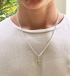 Description This is the perfect, classic sterling silver cross necklace for a man, teenager or even a boy. It is slightly smaller than the Classic Sterling Men's Cross, and is created with clean and simple lines. It features a strong, sterling silver cable chain. Just choose your length. The model is wearing a 20 inch chain. This simple but masculine cross measures 1” x 1/2” and would make a perfect gift for a confirmation, baptism or graduation. It is a classic cross that he will love and be ab Mens Necklace Pendant Sterling Silver, Mens Cross Necklace Silver, Small Silver Cross Necklace, Silver Crucifix Cross Necklace For Everyday, Everyday Silver Cross Pendant Necklace, Everyday Sterling Silver Crucifix Necklace, Simple Sterling Silver Cross Pendant Necklace, Classic Everyday Cross Pendant Necklace, Everyday Classic Cross Pendant Necklace