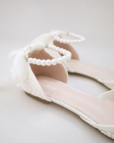 Crochet lace pointy toe flats for comfortable wear throughout your special day and perfect for wedding party. With pearl ankle strap to create a classic yet sophisticated look for any occasion. DETAILS: UPPER: Synthetic upper and lining MATERIALS: Manmade outsole HEEL HEIGHT: 0.3" ORIGIN: Imported