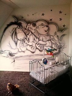 a child's room with a mural on the wall and a crib in front of it