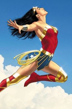 a woman flying through the air with her arms outstretched and legs spread out in wonder costume