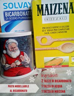 a coffee cup with a santa clause on it and some other items in front of it