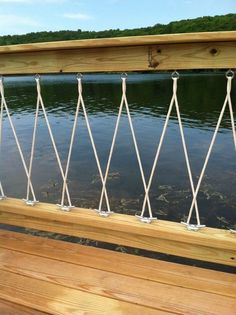 a wooden bench sitting next to a body of water