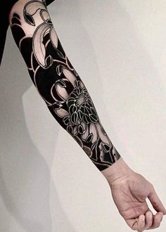 a person with a black and white tattoo on their arm