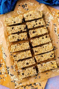 granola bars cut into squares and stacked on top of each other with blueberries