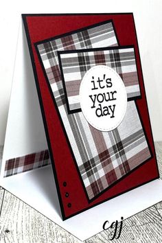 a card with the words it's your day on it and a plaid pattern