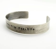 "Oxidized Sterling Silver Personalized 1/2 in wide Cuff Bracelet, Double Sided, Gift for Man, Anniversary, Father's Day Hidden Message, Wedding, Keepsake This beautiful cuff with rustic finish makes a perfect gift for both men and women. It is hand stamped with the text of your choice - I can be names, phrase, song lyrics. It can be stamped on the inside or outside of the bracelet up to 60 characters on either side. If you need a longer quote please contact me for pricing. Pictured cuff has a ox Rustic Stamped Cuff Bracelet Gift, Rustic Silver Bracelets For Gifts, Rustic Silver Bracelet For Gift, Rustic Bangle Cuff Bracelet As Gift, Rustic Stamped Bracelets For Gifts, Rustic Stamped Bracelets For Gift, Personalized Cuff Bracelets, Custom Jewelry Box, Christmas Gift For Him