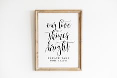 a framed print with the words, one love shines bright please take some shades