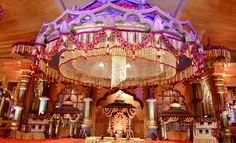 an elaborately decorated room with chandeliers and decorations