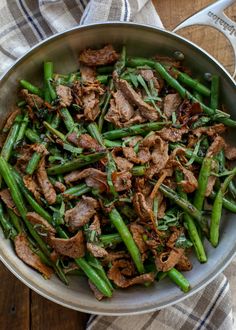 beef and green beans in a skillet with text overlay that reads buttered steak bites with mushrooms dinner beef