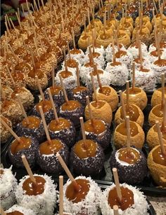 chocolate covered donuts with caramel toppings and toothpicks on skewers