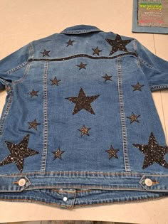 a denim jacket with stars on the back