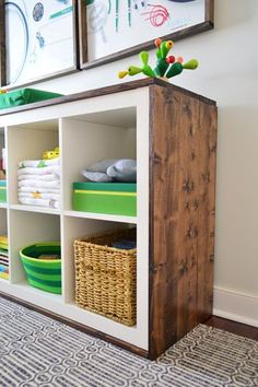 a wooden shelf with baskets on top of it