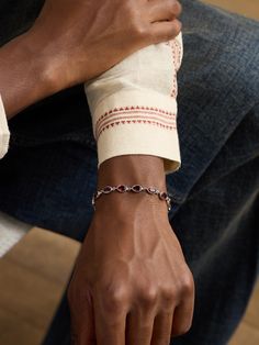 PATTARAPHAN's 'Ying' bracelet has been crafted in its native Bangkok from polished 14-karat white gold. It's modelled after traditional Thai bracelets and bezel-set with faceted garnet stones, including one at the end of the adjustable chain. Polish it with a cloth every so often to retain its shine. Traditional Oval Bracelets For Formal Occasions, Traditional Formal Bracelet With Polished Finish, Traditional Formal Bracelets With Polished Finish, Traditional White Gold Bracelets For Formal Occasions, Luxury Oval Sterling Silver Jubilee Bracelet, Timeless White Gold Bracelet With Gemstone, Timeless White Gold Gemstone Bracelet, Bracelet With Stone, Deep Winter