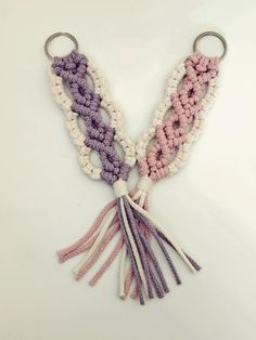 three crocheted tassels are attached to each other