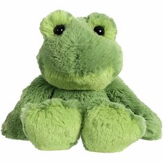 a green frog stuffed animal sitting up against a white background