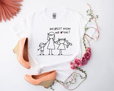 Celebrate the special bond between mother and child with our delightful collection of Mother's Day shirts, perfect for commemorating that unforgettable first Mother's Day. Whether you're a new mom cherishing your very first Mother's Day or looking for a heartfelt gift for the amazing mom in your life, our selection has something for everyone. From charming Mother's Day tees to adorable toddler Mother's Day outfits, we've got you covered. Show your appreciation with our "My Best Mom" shirt, a tou Mother's Day Outfits, Funny Mothers Day Gifts, Extraordinary Women, Day Outfits, Funny Mothers Day, First Mothers Day, Funny Mother, Mothers Day Shirts, Mama Shirt