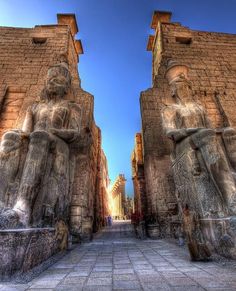 two large stone statues sitting next to each other