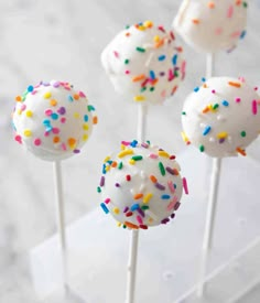 white cake pops with sprinkles on top