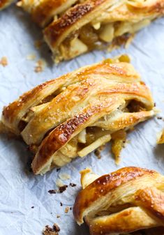 several pieces of pastry sitting on top of a piece of paper