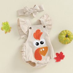 Includes: Romper & BowMaterial: PolyesterGender: GirlsPattern: Turkey FaceSleeve Length: SleevelessSummary: Baby Toddler Sleeveless Ruffled Turkey Face Romper with Matching Bow 2 Piece Thanksgiving Set Newborn Turkey Outfit, Turkey Applique, Burlap Turkey Door Hanger, Embroidery Jumpsuit, Baby Turkey Shirt, Baby Turkey, Baby Girl Ruffle Romper, Casual Bodysuit, Boys Romper