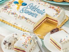 a celebration cake and desserts are on the table