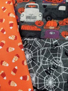 three different halloween themed ties on top of each other