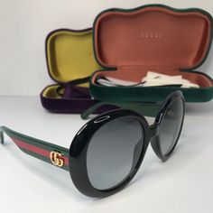 Gucci Web Sunglasses Gg0712s 001 Black-Green-Red/Grey Gradient Lens 55mm Additional Info: Lens-55 Bridge-21 B-Vertical Height-55.1 Temple-140mm Item Includes: Gucci Sunglasses Gucci Case(Color & Style May Vary) Gucci Dust Bag Gucci Cleaning Cloth Gucci Certificate Of Authenticity Gucci Gg0712s Sunglasses Includes The Gucci Logo On The Temple. This Gucci Gg0712s Acetate Full Rim Round Shape Sunglasses Made For Women. Shape Sunglasses, Oversized Fashion, Pink Polka Dot Dress, Silver Sunglasses, Gucci Logo, Grey Gradient, Oversize Fashion, Gucci Sunglasses, Gucci Accessories