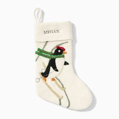 a white christmas stocking with a penguin on it