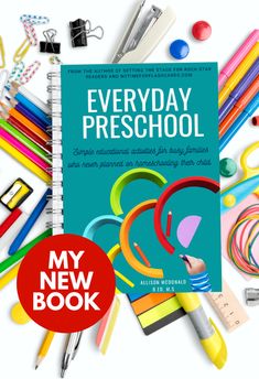 the book is surrounded by school supplies and pens, pencils, markers, crayons