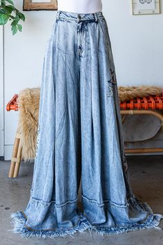 Be a star in our STAR EMBROIDERY WASHED TENCEL WIDE PANTS. With a mineral wash detail for a cool finish and a relaxed fit that'll have you feeling extra comfy, these pants are sure to be a hit! Trust us - they're true to size, so no worries there! And at 100%TENCEL, you can be sure you're getting quality. So why not take a shine to them today? Small- 4-6 Medium-8-10 Large 12 Bohemian Medium Wash Denim Pants, Soft-washed Wide Leg Bottoms For Fall, Dark Wash Stonewashed Bottoms For Spring, Baggy Wide Leg Washed Pants, Spring Dark Wash Stonewashed Bottoms, Fall Soft-washed Wide Leg Bottoms, Acid Wash Denim Mid-rise Bottoms, Spring Stonewashed Dark Wash Bottoms, Stonewashed Relaxed Fit Bottoms For Spring