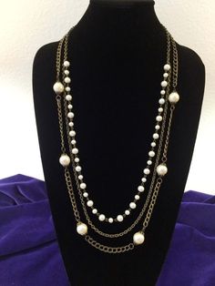 (60001 B1 VJN ) Beautiful & Classic, This 1970's three strand, chain and pearl necklace by Talbots, is accented with two shades, and sizes of pearls, in an antique gold finish.  30 inches in length with a lobster claw closure. IMPORTANT PLEASE READ *IF YOU REQUIRE DELIVERY BY A CERTAIN DATE, YOU MUST SEND A MESSAGE TO SHOP OWNER SO THAT WE MAY ATTEMPT TO ACCOMODATE YOUR REQUEST  **IN SOME CASES, LIKE OVERNIGHT DELIVERY, SHIPPING CHARGES MAY NEED TO BE ADDED IN ORDER TO GET YOUR ITEM TO YOU BY YO Chain And Pearl Necklace, Three Strand Necklace, Shop Owner, Sea Pearls, Vintage Pearls, Vintage Avon, Vintage Yellow, Strand Necklace, True Vintage