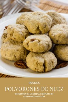 a white plate topped with cookies on top of a table