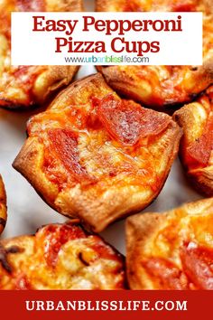 mini pizzas with cheese and pepperoni sitting on top of each other in a pile