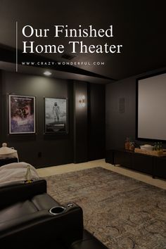 a home theater with the words our finished home theater on it's screen wall