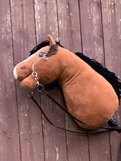 a stuffed horse is laying on the ground