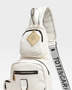 The White Apollo 1 Cross-body Bag is the perfect sling bag for carrying small items without compromising on style. It combines an elegant design with functional storage space that is ideal for small belongings such as keys, wallet, check-book, credit cards or smartphones. Rolling Duffle Bag, Cross Body Sling Bag, Nylon Travel Bag, Apollo 1, Check Book, Suitcase Set, Bag Suitcase, Duffle Bag Travel, Clutch Pouch