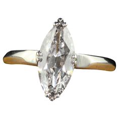 an engagement ring with a pear shaped diamond