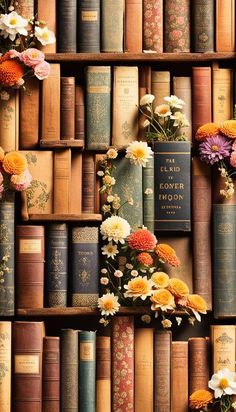 a book shelf filled with lots of books covered in flowers