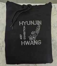 If Hyunjin ever had an art exhibit, I hope it'd look a bit like this.  This is made on a 50% cotton 50% polyester hoodie with the fabric weight of 8.0 oz/yd² (271.25 g/m²). I would compare this to a hoodie that you layer in the winter and wear by itself in the fall and spring. If you're looking for a heavier hoodie, I can also put this on a hoodie that is 65% cotton and 35% polyester with a fabric weight of 8.5 oz./yd.² (288.2 g/m²) for an extra $4. This option is only available for black and white colored hoodies.  Please keep in mind the design is 6x6 inches, larger than my other designs! I will not be making a smaller version of this design for tshirts/jackets/crop tops, but please check out my other designs if that's an apparel item you would like.  This product is made especially for Hyunjin Art, Stray Kids Fashion, Hoodie Merch, Stray Kids Outfits, Clothes Korean Style, Embroidery Hoodie, Art Exhibit, Embroidery Shop, Quotes For Book Lovers