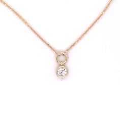 14k yellow gold diamond solitaire necklace. This 1mm diamond cut cable chain features a genuine .33 carat round brilliant bezel set diamond drop set below a solid stationary circle attached. Diamond quality is SI2 clarity G-H color. Chain length is 16 inches. 3 Carat Diamond, 16 Inch Necklace, Solitaire Necklace, Diamond Solitaire Necklace, Solitaire Necklaces, Bezel Set Diamond, Diamond Settings, Diamond Drops, Solitaire Pendant