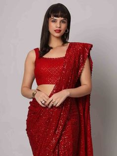 Wear this stunning red sequins georgette cocktail party wear a saree with a blouse and make heads turn at any event. Designed with intricate sequin work and a beautiful sequin floral border, this saree is made from high-quality georgette material that ensures comfort and elegance. The heavy sequin work on both the saree and blouse adds a touch of glamour to your outfit, making it perfect for parties and receptions.
This designer saree comes in a vibrant red color that exudes grace and sophistica Bollywood Style Festive Pre-draped Saree With Sequins, Sequin Pre-draped Chinon Saree, Glamorous Festive Pre-draped Saree For Celebration, Sequin Chinon Pre-draped Saree For Diwali, Bollywood Style Pre-draped Saree With Sequins, Glamorous Sequined Lehenga In Chinon, Party Pre-draped Chinon Saree With Mirror Work, Embellished Fitted Saree For Celebration, Fitted Embellished Chinon Saree