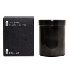 the home roasted coffee is next to a black box and it's packaging