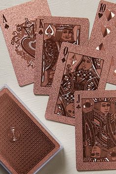 the playing cards have been designed to look like they are made out of copper foil