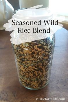 a mason jar filled with wild rice on top of a wooden table