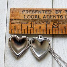 "A stainless steel heart locket hangs from a vintage stainless steel chain to make this simple and easy to wear necklace. The locket measures 25mm, a little under 1\". Choose length at checkout. 16\". 18\". 20\". 22\". 24\". Please excuse any reflections in the shiny surface of the heart. I tried my best to hide! More heart jewelry can be found here: http://etsy.me/1Stzj2o To see more of my handmade jewelry in my Etsy shop, click this link: WearYourWild.etsy.com All jewelry comes nestled in recy Hag Stones, I Tried My Best, Heart Locket Necklace, Heavy Chain, Wear Necklaces, Heart Locket, Support Handmade, Locket Necklace, Heart Jewelry