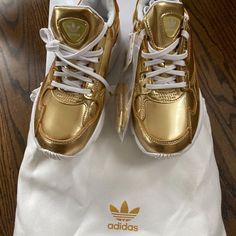 New In Box With Tags Gold Adidas Women’s Falcon. They Run A Little Large For Me. I’m A Street Size 6. Cleaning Out My Closets. All Purchases Are Recorded Including Shipping Label And Packing To Support Safe Delivery To Final Destination. Gold Tennis Shoes, Adidas Soccer Shoes, Adidas Gold, Adidas Ultraboost 20, Adidas Falcon, Gold Adidas, White Tennis Shoes, White Running Shoes, Gold Sneakers