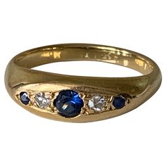 Antique 18ct Gold Ring Dark Blue Sapphires - 0.13 Carat in total main sapphire 0.10 Carat with two Diamonds either side - 0.06 carat Stamped 18ct U.K Size P 1/2 U.S Size 7 3/4 Antique Sapphire Ring Gold, Luxury Gold Engraved Sapphire Ring, Edwardian Ring, Gold Sapphire Ring, Dark Sapphire, Sapphire And Diamond Ring, Vintage Style Rings, Ring Inspo, Three Rings