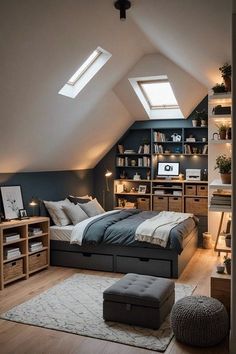 an attic bedroom with slanted ceilings and skylights